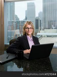 Smiling Businesswoman with Laptop