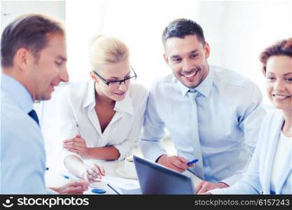 smiling businesswoman with team on meeting in office. businesswoman with team on meeting in office