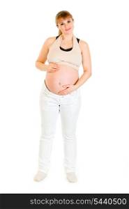Smiling charming pregnant woman holding her belly isolated on white background&#xA;