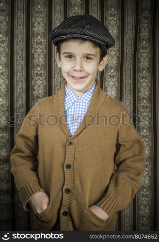 Smiling child in vintage clothes and hat. Close up shot