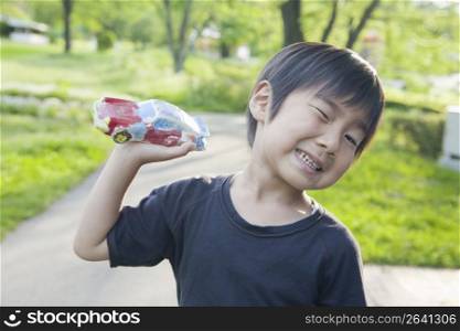 Smiling child with car