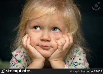 smiling child with lying on her bed