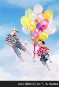 Smiling children flying with balloons