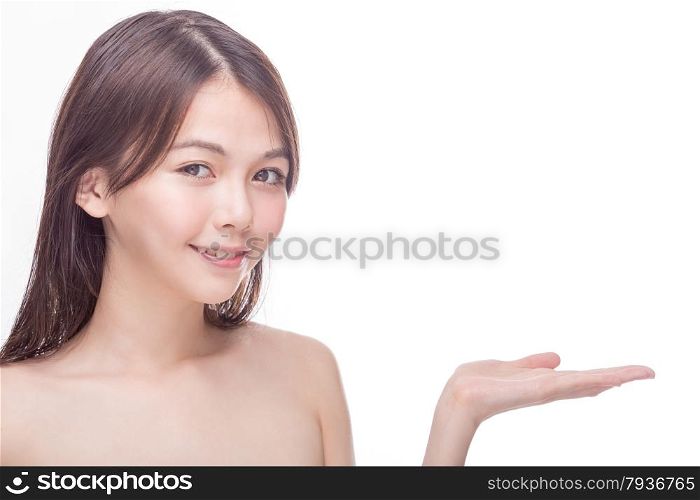 Smiling Chinese woman showing white copy space for text or product