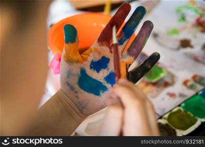Smiling colorful children hands
