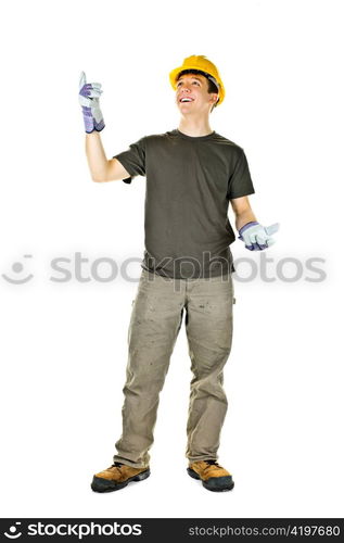 Smiling construction worker pointing up standing isolated on white background