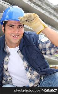 Smiling construction worker wearing a hardhat