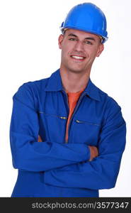 smiling construction worker with folded arms