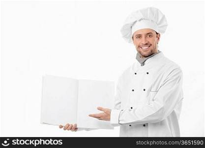 Smiling cook holding an empty menu on a white background