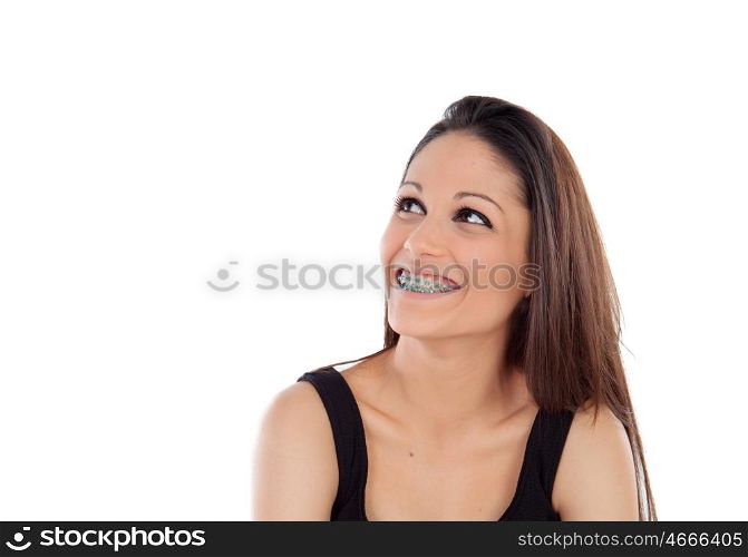 Smiling cool girl with brackets looking up isolated on a white background