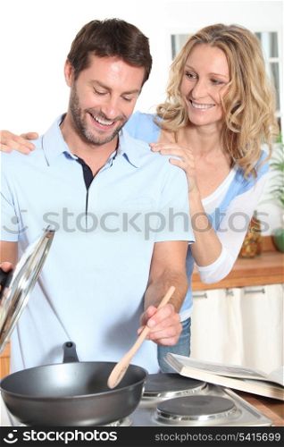Smiling couple cooking