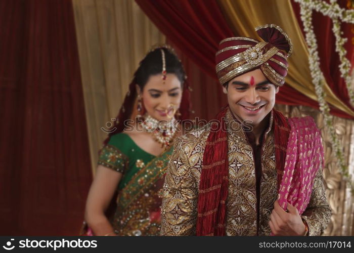 Smiling couple during wedding ceremony