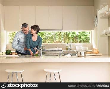 Smiling couple in kitchen