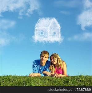 smiling couple on grass and dream cloud house collage