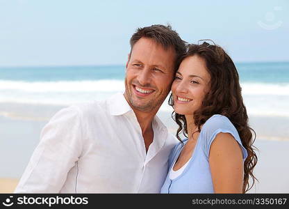 Smiling couple on vacation at the beach