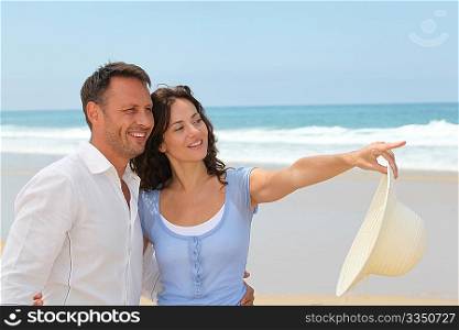 Smiling couple on vacation at the beach