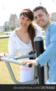 Smiling couple playing outdoors