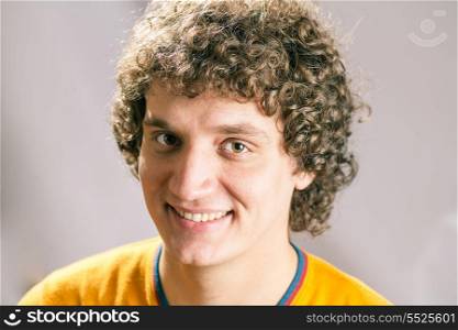 Smiling Curly white man in studio