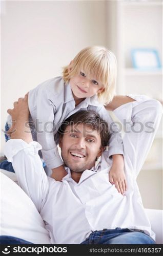 Smiling Dad and young son