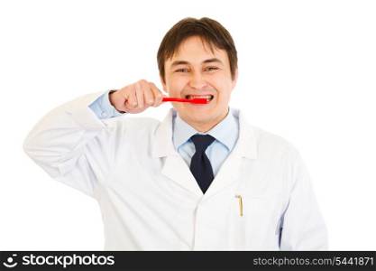 Smiling dentist with toothbrush showing how to clean teeth properly isolated on white&#xA;