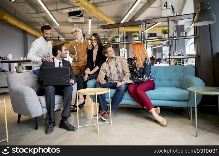 Smiling diverse businesspeople talking together in an office