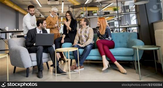 Smiling diverse businesspeople talking together in an office