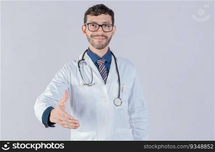 Smiling doctor shaking hands in welcome sign isolated. Friendly male doctor extending hand to camera isolated