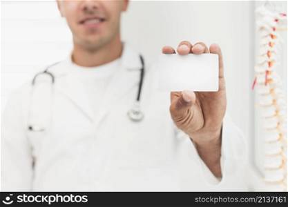 smiling doctor showing card mock up