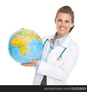 Smiling doctor woman holding earth globe