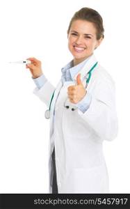Smiling doctor woman holding thermometer and showing thumbs up