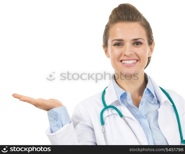 Smiling doctor woman presenting something on empty palm