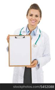 Smiling doctor woman showing clipboard