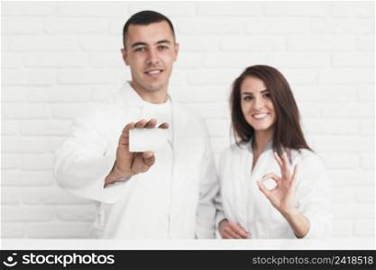 smiling doctors showing ok sign card mock up