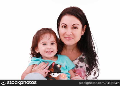 Smiling embracing mom and daughter looking at camera