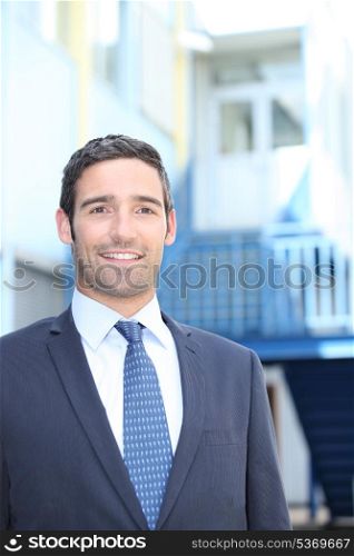 Smiling entrepreneur on a site