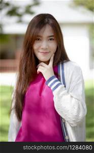 smiling face happiness emotion of beautiful asian younger woman standing outdoor