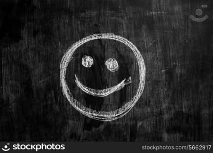 smiling face on blackboard