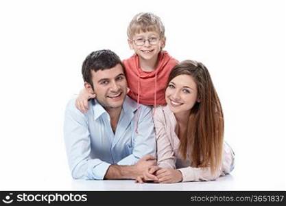 Smiling family with a child on a white background