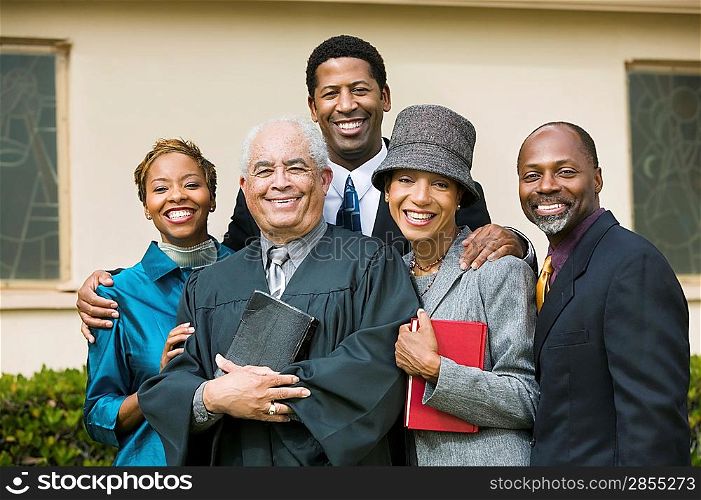 Smiling Family with Preacher