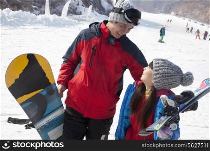 Smiling Father and Daughter in Ski Resort
