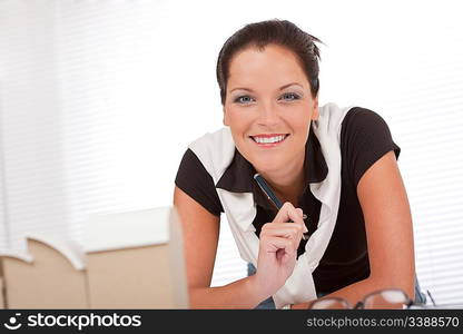 Smiling female architect working at the office