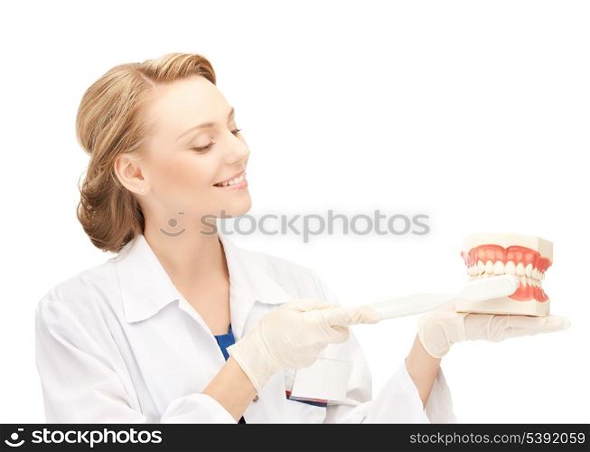 smiling female doctor with big jaws and toothbrush..