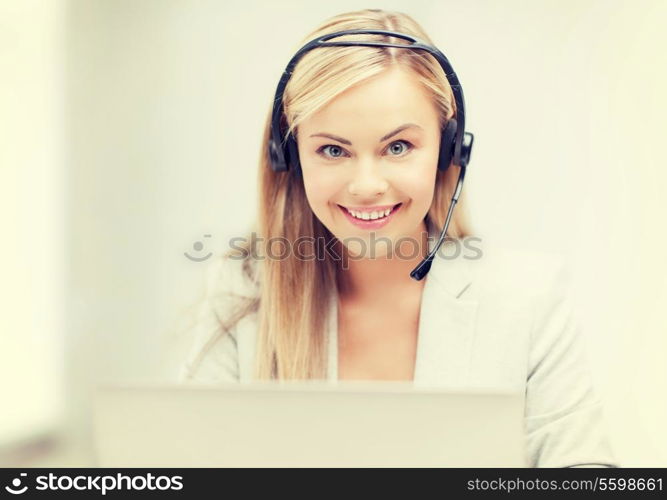 smiling female helpline operator with headphones and laptop