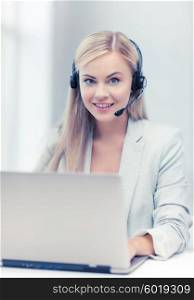 smiling female helpline operator with headphones and laptop. friendly female helpline operator with laptop