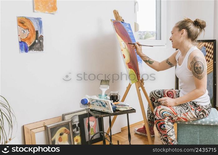 smiling female painting picture canvas
