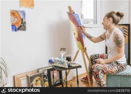 smiling female painting picture canvas
