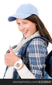 Smiling female teenager girl wear cool outfit thumb up
