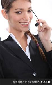 Smiling female telemarketer