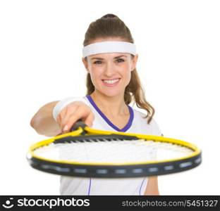Smiling female tennis player pointing racket in camera