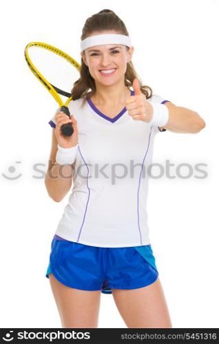 Smiling female tennis player with racket showing thumbs up